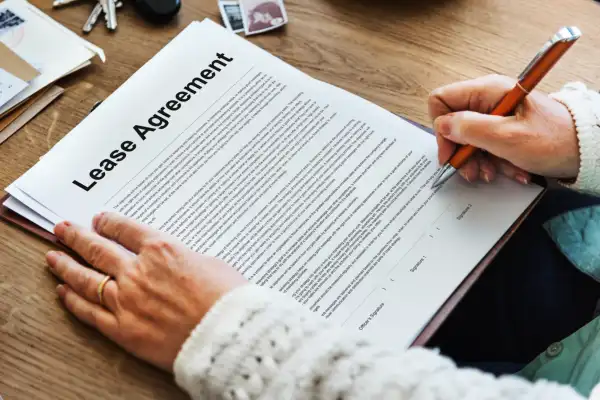 Signing a business lease agreement to secure a new flexible coworking for startups office location.